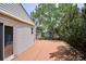 Wood deck off of house, with partial view of fenced backyard and storage shed at 800 Park View Pl, Castle Rock, CO 80104