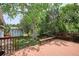 Enjoy outdoor living on this wooden deck, nestled in a lush backyard with mature trees and a charming shed at 800 Park View Pl, Castle Rock, CO 80104