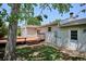 Exterior view of home with a wood deck, partially shaded by a mature tree at 800 Park View Pl, Castle Rock, CO 80104
