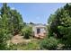 View of backyard featuring a wood deck and lush landscaping at 800 Park View Pl, Castle Rock, CO 80104