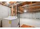 Unfinished basement includes laundry area with washer and dryer, and space for storage or customization at 800 Park View Pl, Castle Rock, CO 80104