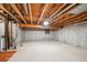 Unfinished basement area with exposed ceiling, concrete walls and floors, offering potential for customization at 800 Park View Pl, Castle Rock, CO 80104