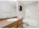 Bathroom featuring a tub/shower combo, a wooden vanity, and a large mirror at 800 Park View Pl, Castle Rock, CO 80104