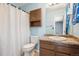This bathroom is equipped with a wooden vanity and a shower/tub combo at 800 Park View Pl, Castle Rock, CO 80104