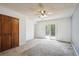 Bright bedroom with a ceiling fan and access to a private deck at 800 Park View Pl, Castle Rock, CO 80104