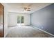 Spacious bedroom boasts a ceiling fan, large windows, and private deck access at 800 Park View Pl, Castle Rock, CO 80104