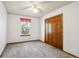 A simple bedroom with a large closet and window providing natural light at 800 Park View Pl, Castle Rock, CO 80104