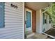 Close-up of the home's front door with brick accents and light blue trim at 800 Park View Pl, Castle Rock, CO 80104