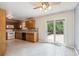 Efficient kitchen layout with wood cabinets and a sliding door to the backyard deck at 800 Park View Pl, Castle Rock, CO 80104