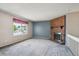 Open living space with fireplace, large windows, and views of the front yard at 800 Park View Pl, Castle Rock, CO 80104