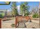 Well-maintained backyard deck area, featuring a charming wooden railing and brick pavers at 12258 E Lasalle Pl, Aurora, CO 80014