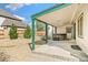 Backyard patio featuring a hot tub and gravel landscaping with mature trees and an open outdoor space at 12258 E Lasalle Pl, Aurora, CO 80014