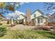 Backyard featuring a covered patio, deck, and brick chimney at 12258 E Lasalle Pl, Aurora, CO 80014