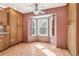 Breakfast nook with hardwood floors and large bay windows overlooking the yard at 12258 E Lasalle Pl, Aurora, CO 80014