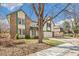 Classic two-story house with brick detailing, an attached garage, and a well-groomed front yard at 12258 E Lasalle Pl, Aurora, CO 80014