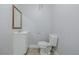 Small bathroom with toilet and sink at 1628 Chester St, Aurora, CO 80010