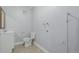 Small bathroom with toilet, sink, and vanity at 1628 Chester St, Aurora, CO 80010