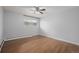 Simple bedroom with wood flooring and ceiling fan at 1628 Chester St, Aurora, CO 80010