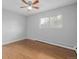 Simple bedroom with wood flooring and ceiling fan at 1628 Chester St, Aurora, CO 80010