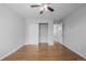 Bedroom with wood floors, closet, and ceiling fan at 1628 Chester St, Aurora, CO 80010