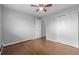 Bedroom with wood floor, closet and ceiling fan at 1628 Chester St, Aurora, CO 80010