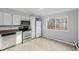 Kitchen with stainless steel appliances and white cabinets at 1628 Chester St, Aurora, CO 80010