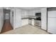 Bright kitchen features stainless steel appliances and white cabinets at 1628 Chester St, Aurora, CO 80010