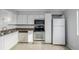 Kitchen with white cabinets and stainless steel appliances at 1628 Chester St, Aurora, CO 80010