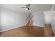 Living area with hardwood floors and staircase at 1628 Chester St, Aurora, CO 80010