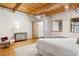 Spacious bedroom with wood floors and exposed beams at 2955 Inca St # 1D, Denver, CO 80202