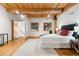 Well-lit bedroom with hardwood floors and a large window at 2955 Inca St # 1D, Denver, CO 80202