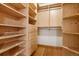 Large walk-in closet with custom built-in shelves at 2955 Inca St # 1D, Denver, CO 80202