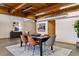 Modern dining area featuring a large table, stylish chairs, and an area rug at 2955 Inca St # 1D, Denver, CO 80202