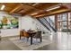 Open dining area with modern table and chairs, near staircase at 2955 Inca St # 1D, Denver, CO 80202
