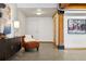 Bright entryway with contemporary furniture and exposed beams at 2955 Inca St # 1D, Denver, CO 80202