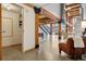 Open living space showcasing a modern staircase and exposed brick at 2955 Inca St # 1D, Denver, CO 80202