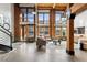Open concept living area with exposed beams and high ceilings at 2955 Inca St # 1D, Denver, CO 80202