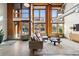 Open living space showcasing high ceilings and exposed ductwork at 2955 Inca St # 1D, Denver, CO 80202