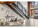 Stylish modern staircase with metal railing and wood steps at 2955 Inca St # 1D, Denver, CO 80202