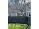 Backyard features a well-maintained lawn, privacy fence, and mature trees, providing a serene outdoor space at 10810 Summerset Way, Parker, CO 80138