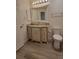 Well-lit bathroom featuring a vanity with granite counters and ample cabinet space at 10810 Summerset Way, Parker, CO 80138
