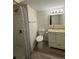 Well-lit bathroom featuring a shower, toilet, modern vanity, and neutral color scheme at 10810 Summerset Way, Parker, CO 80138