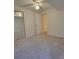 Bedroom featuring neutral carpet, ample closet space, and a well-lit interior at 10810 Summerset Way, Parker, CO 80138