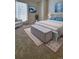 Stylishly furnished bedroom with a large window and comfortable seating area at 10810 Summerset Way, Parker, CO 80138