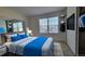 Comfortable bedroom with a large window, closet, and entertainment space at 10810 Summerset Way, Parker, CO 80138