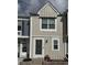 Charming two-story townhouse with light tan vertical siding and white trim at 10810 Summerset Way, Parker, CO 80138