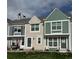 Three townhouses of different colors with landscaped lawns in a suburban neighborhood at 10810 Summerset Way, Parker, CO 80138