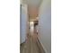 Hallway that flows to living room and kitchen with laminate flooring at 10810 Summerset Way, Parker, CO 80138