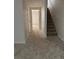 Inviting hallway features carpeted floors, staircase, and easy access to other rooms at 10810 Summerset Way, Parker, CO 80138