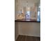 Open-concept kitchen with white cabinets and stainless sink at 10810 Summerset Way, Parker, CO 80138